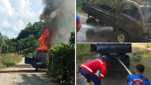 Personel Damkar Sintang bergerak cepat memadamkan api yang menghanguskan satu unit mobil pick up
